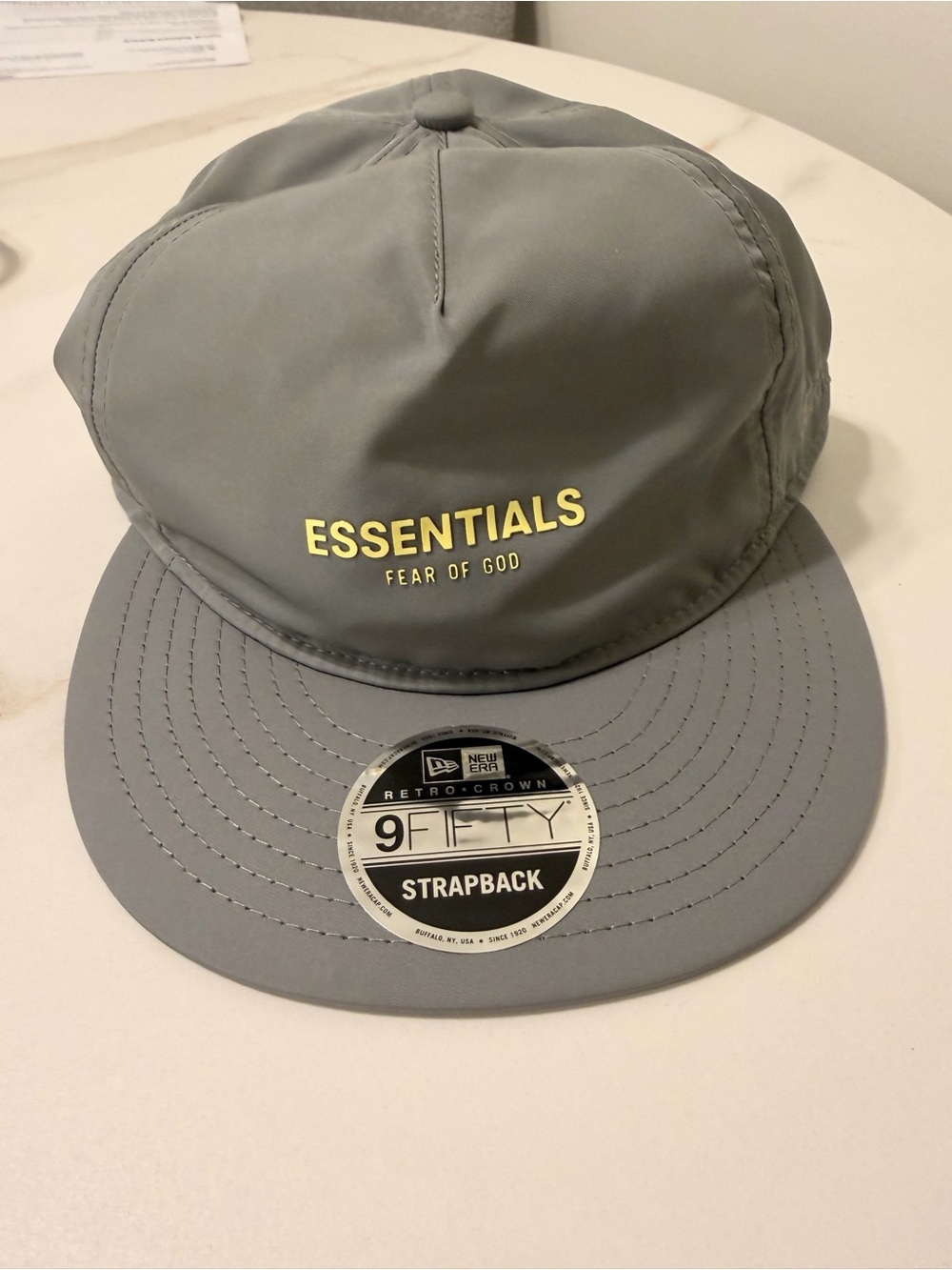 Fear of God Essentials Gray Strapback Hat with Yellow Logo